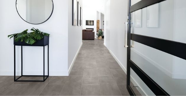 entryway and long hallway with gray oversized tile